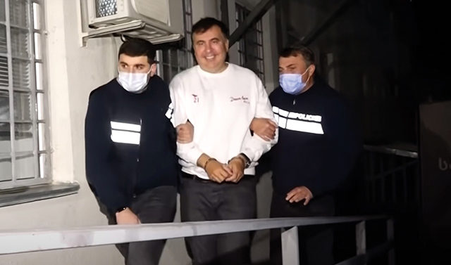 saakashvili-in-handcuffs-e1640849302694-1779630999.jpg